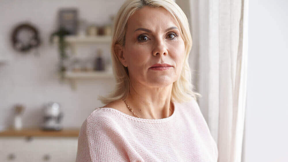 middle aged woman looking overwhelmed