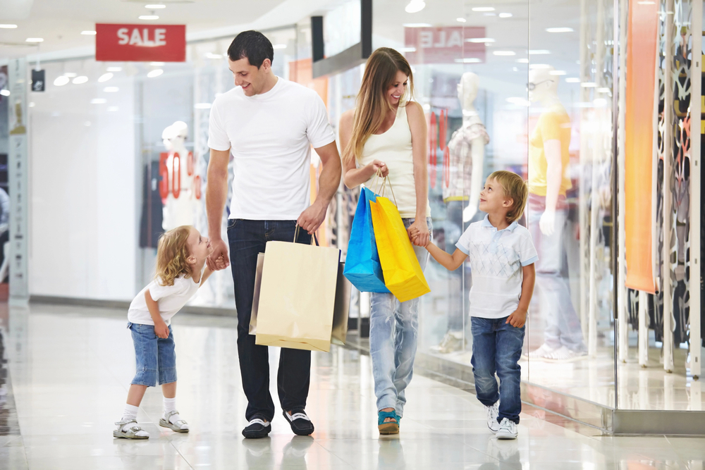 A family going shopping. Rakuten is one of the best cash-back apps to scan receipts for money.