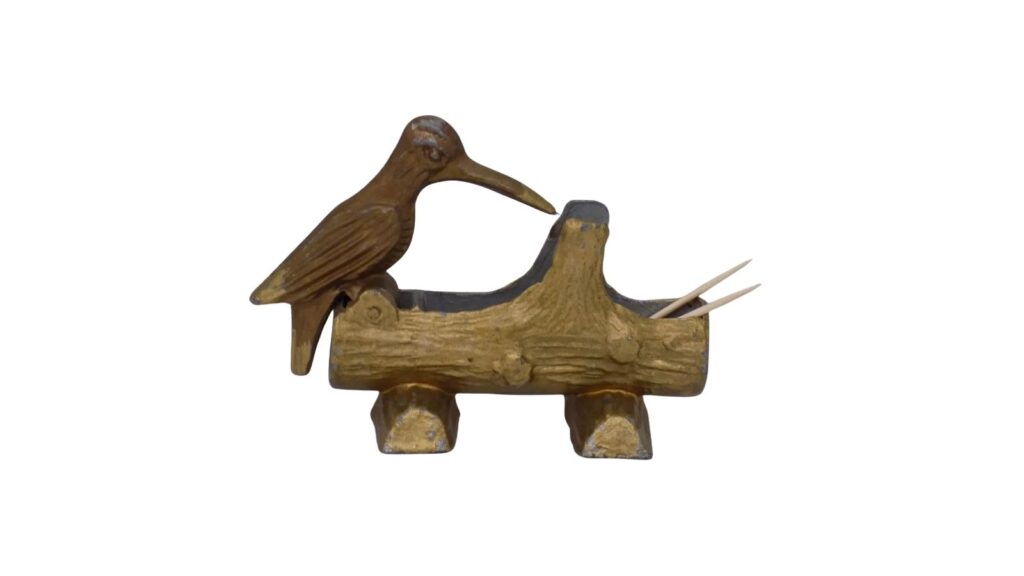 Cast iron woodpecker toothpick dispenser