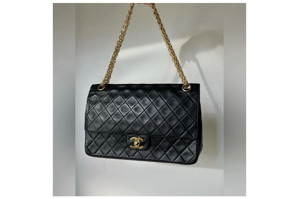 Vintage black quilted Chanel flap bag with gold CC clasp and chain strap