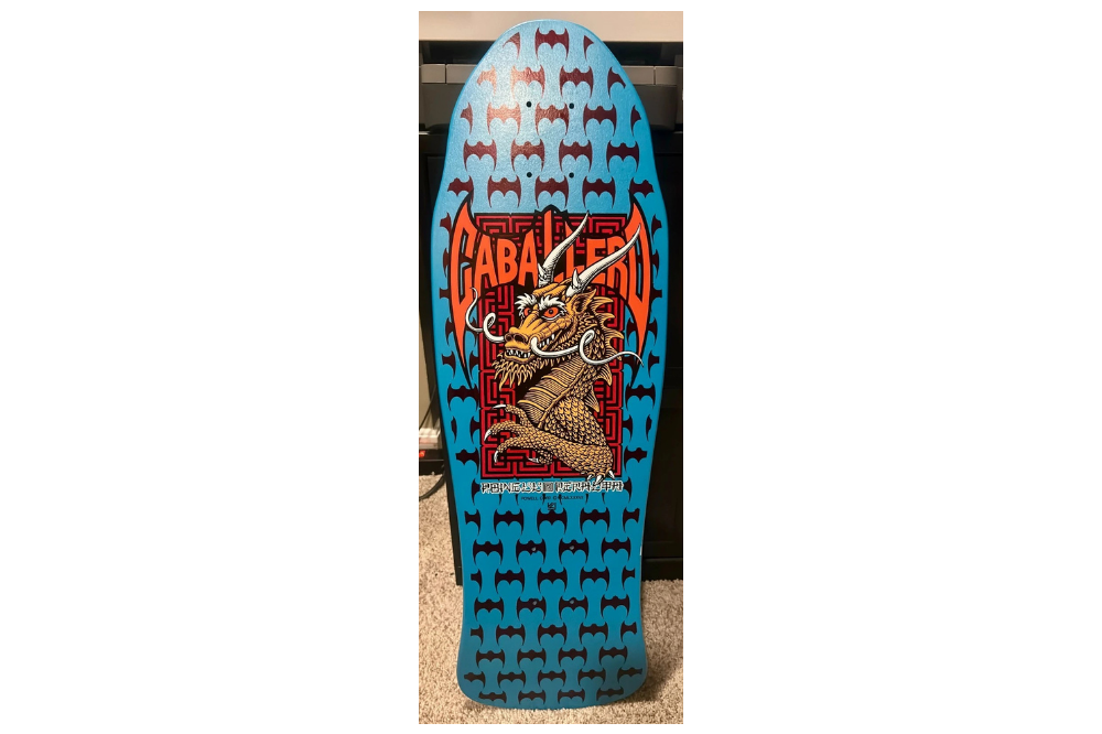 Blue 1987 Powell Peralta Steve Caballero skateboard deck with dragon and bat graphics
