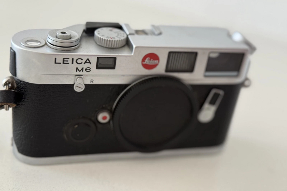 Vintage silver Leica M6 rangefinder camera body with black covering