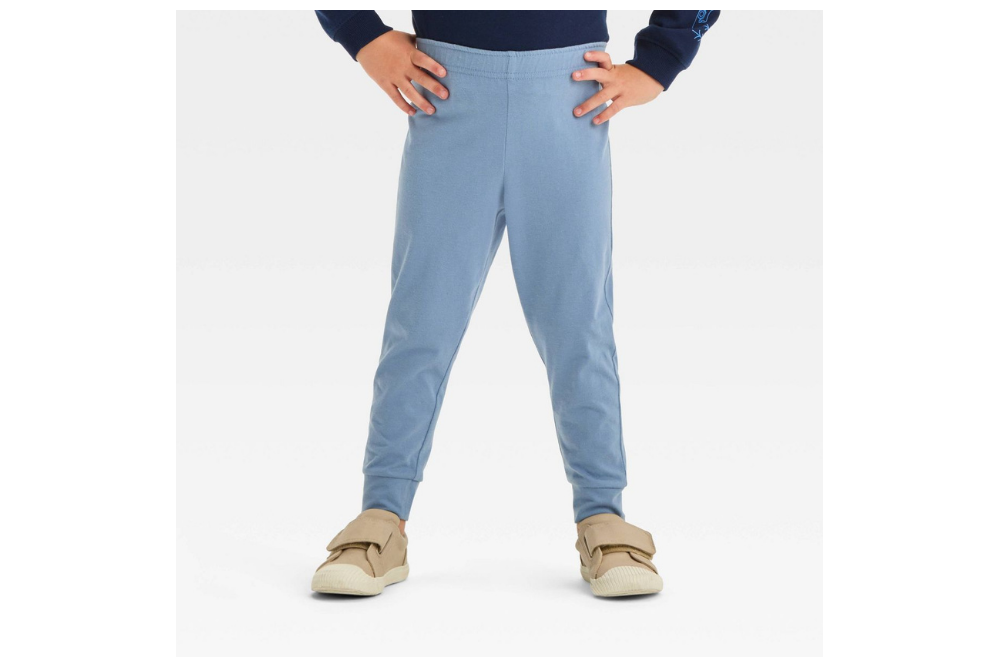 Child wearing blue Cat & Jack jersey jogger pants