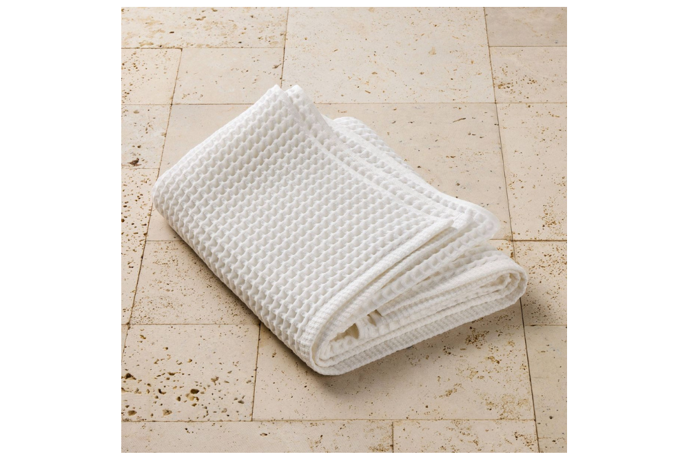 Folded white Casaluna waffle bath towel