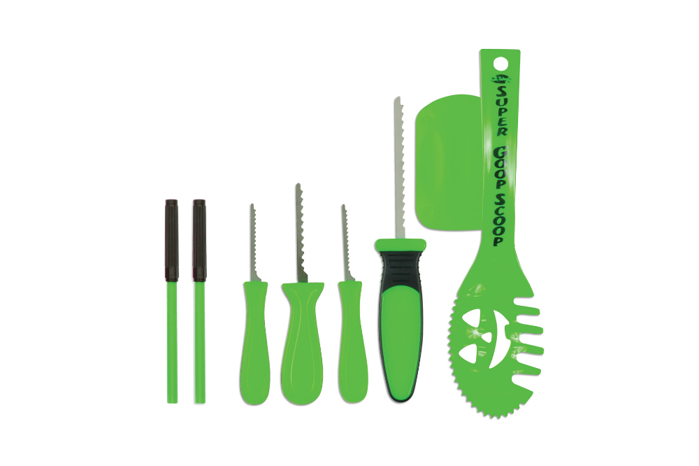 Green pumpkin-carving tools and scoops arranged together