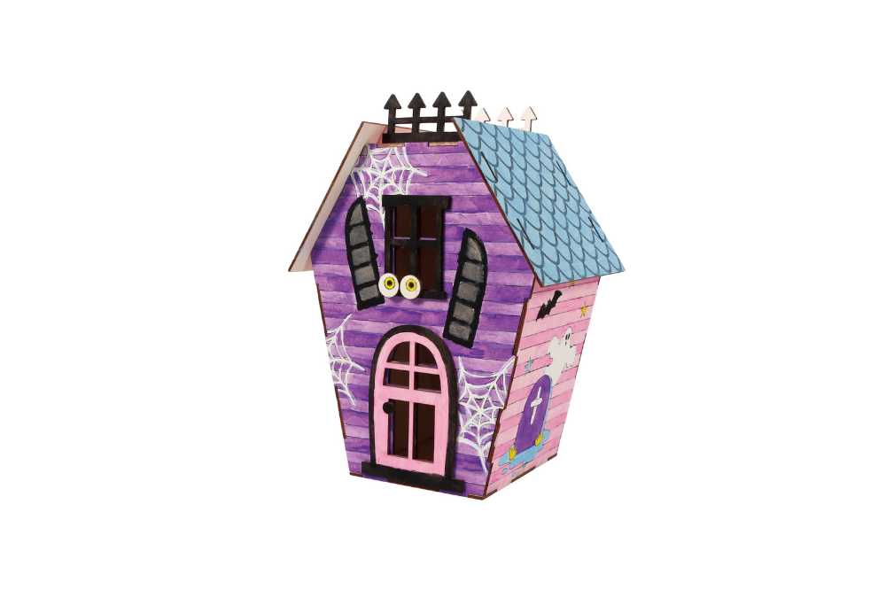 Small colorful haunted-house craft model with a purple roof