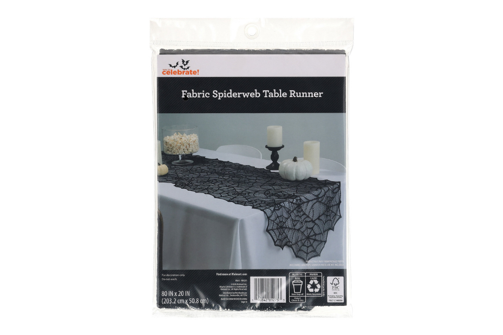 Packaged black lace spiderweb table runner