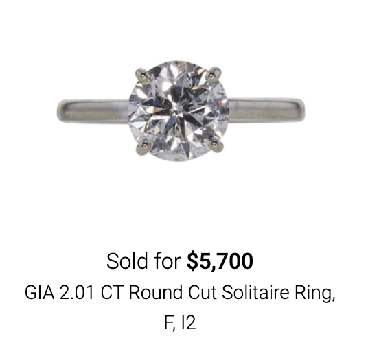 Round cut solitaire diamond ring sold on online jewelry auction site Worthy. 