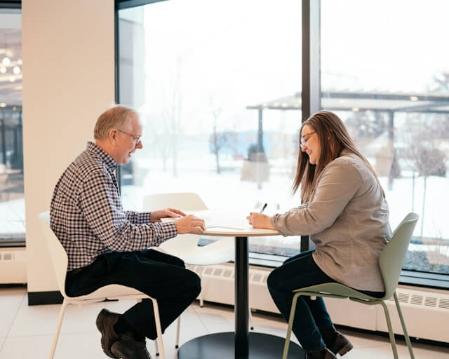 mature person listening in meeting