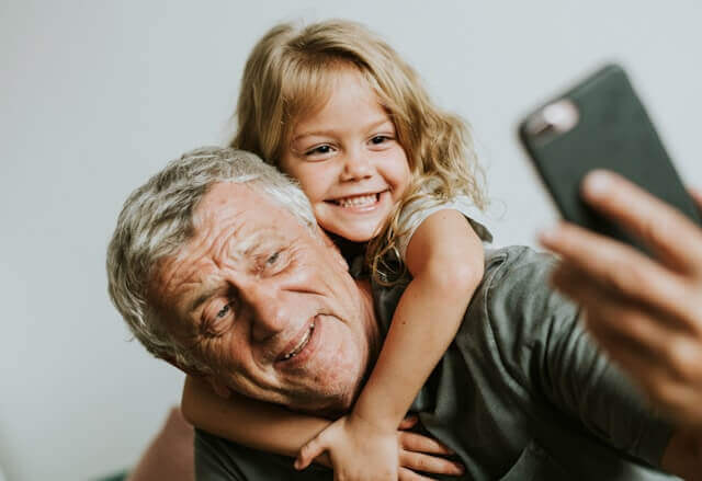 carrying grandaughter on shoulders