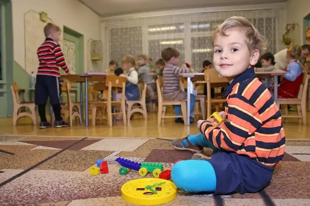 Child at day care center while mom works.