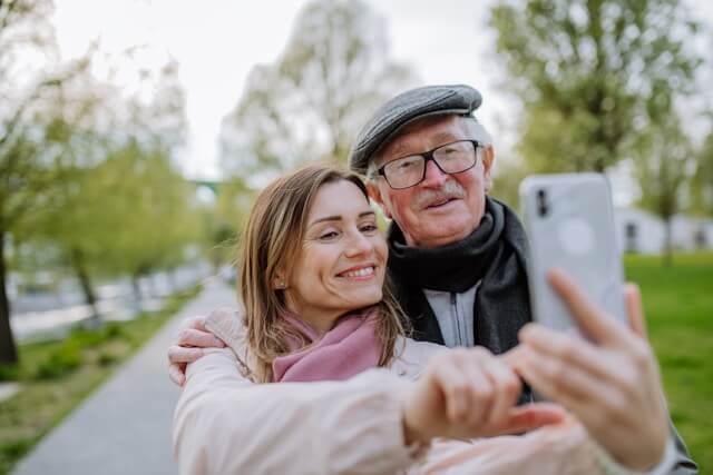 daughter with father taking selfie