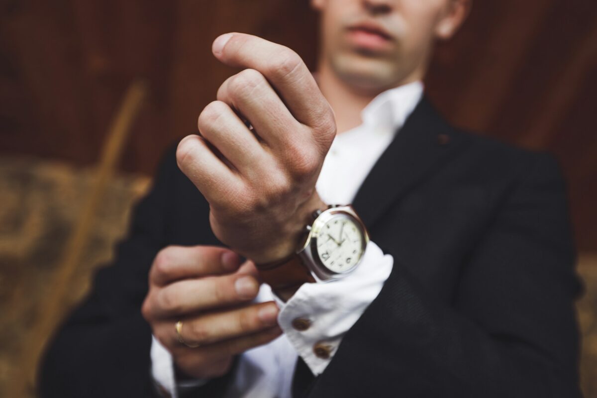 wearing a Rolex watch