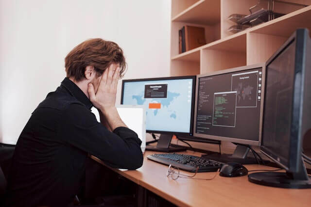 looking sad at a computer