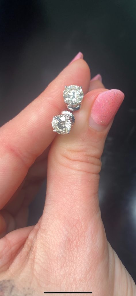 Pair of diamond earrings bought by Diamonds USA on post about how to sell diamonds.