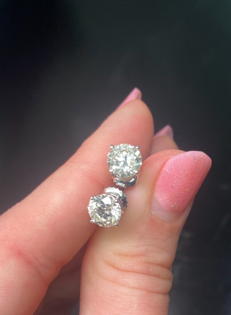 Pair of diamond earrings bought by Diamonds USA on post about how to sell diamonds.