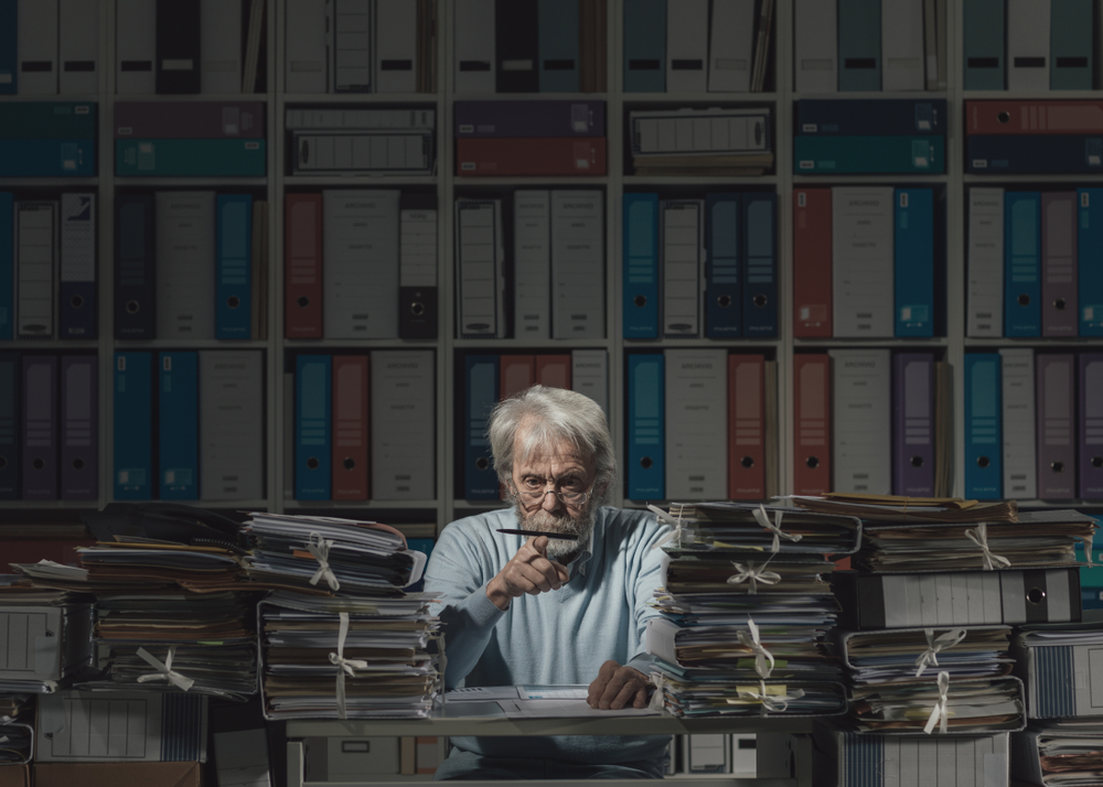 really old person working in office