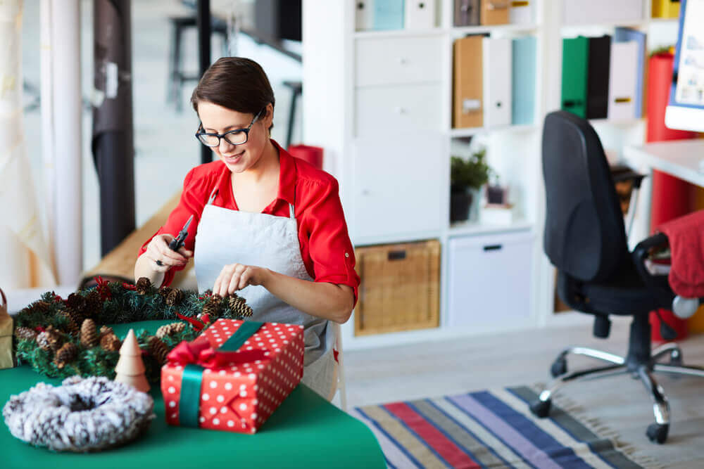 woman making wreaths at Christmas to sell