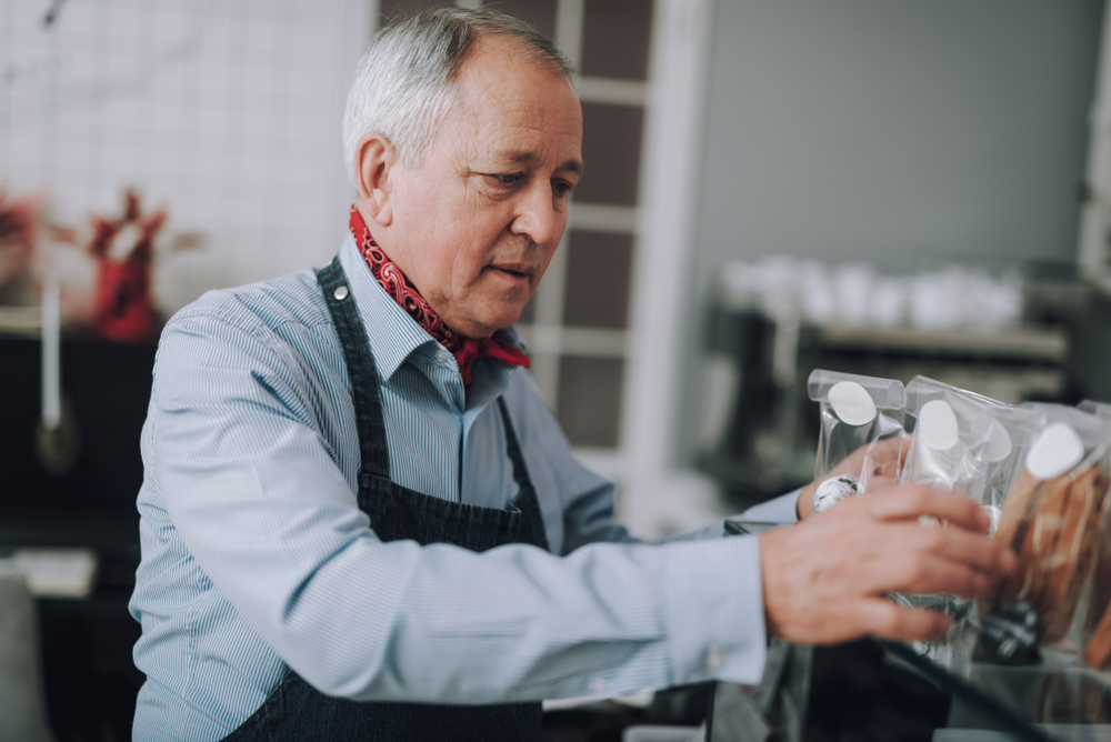 senior person working in store