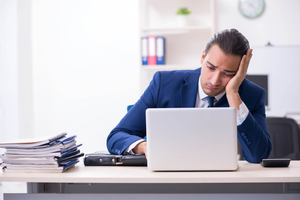 businessman bored at work