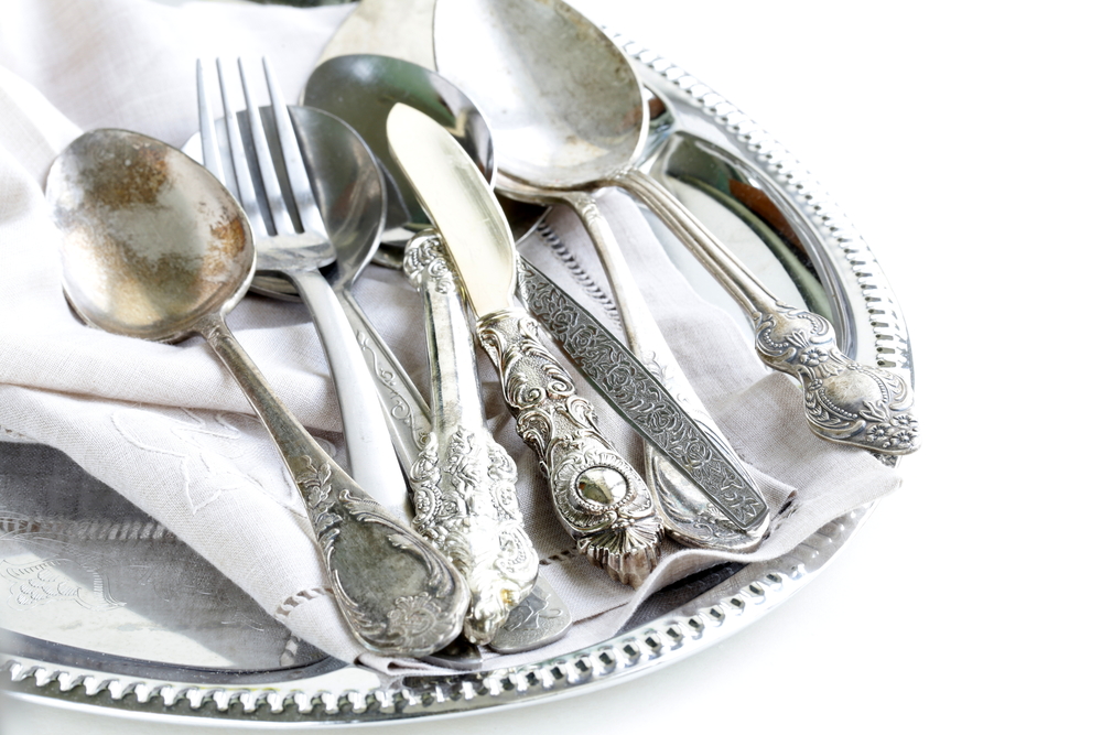 silver cutlery on a tray