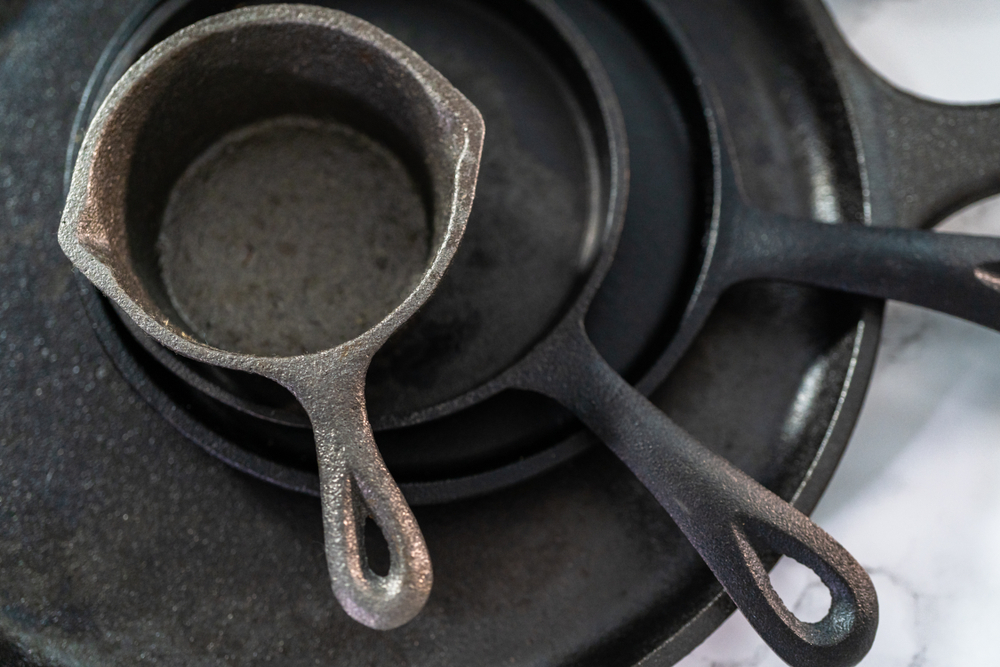 selection of cast iron in thrift store