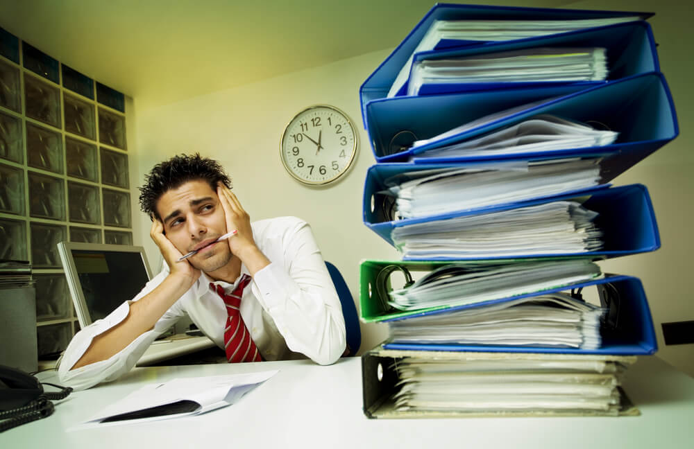 depressed and exhausted man in his work