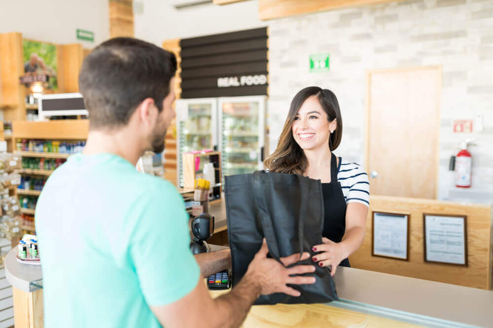 man buying item in a store