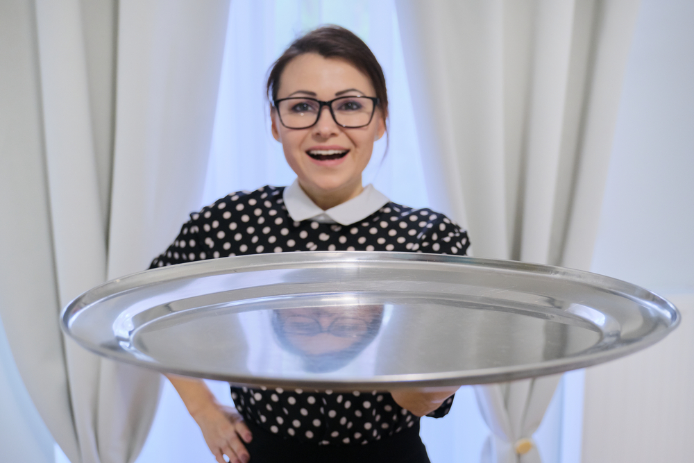 woman and silver tray