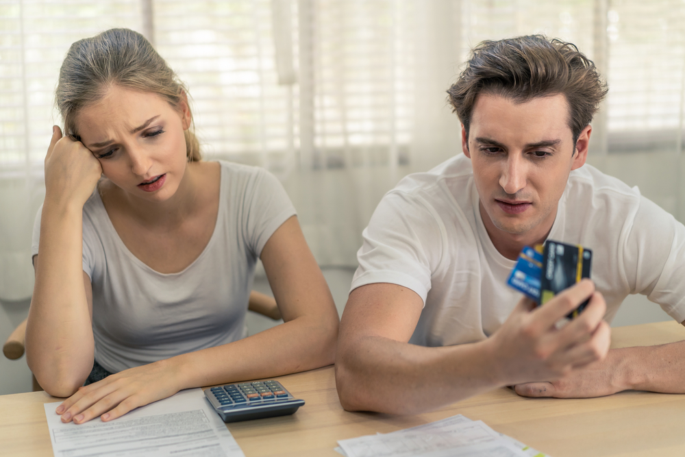 couple stressed about credit card bills