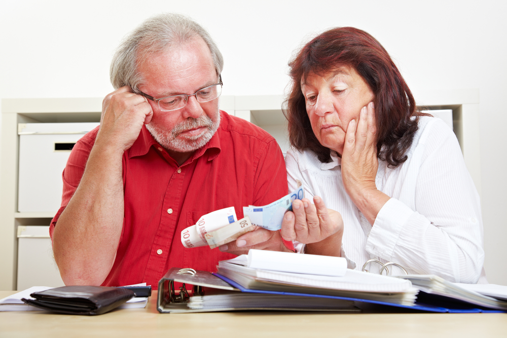 senior couple worried about money