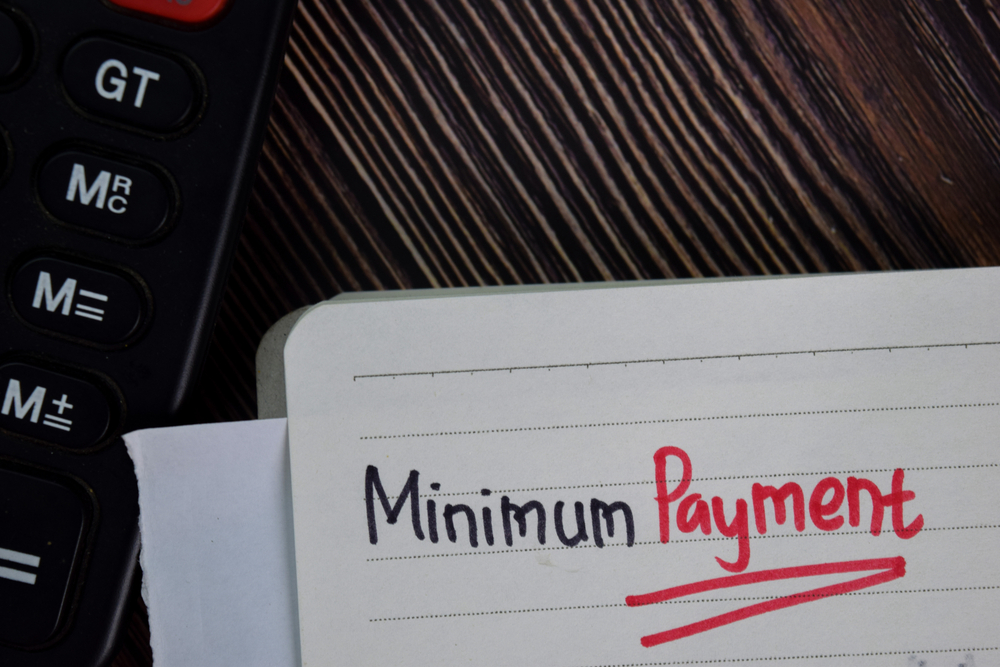 minimum payment written on white paper