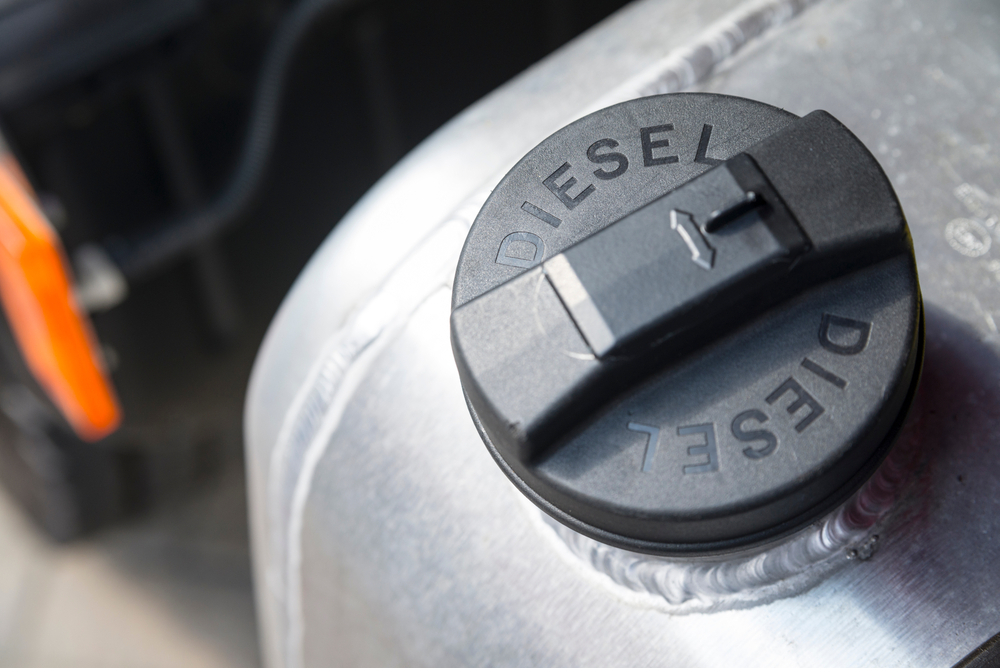 Black cap labeled Diesel on a truck fuel tank