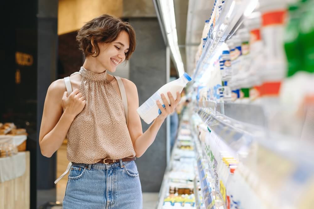 happy woman grocery shopping