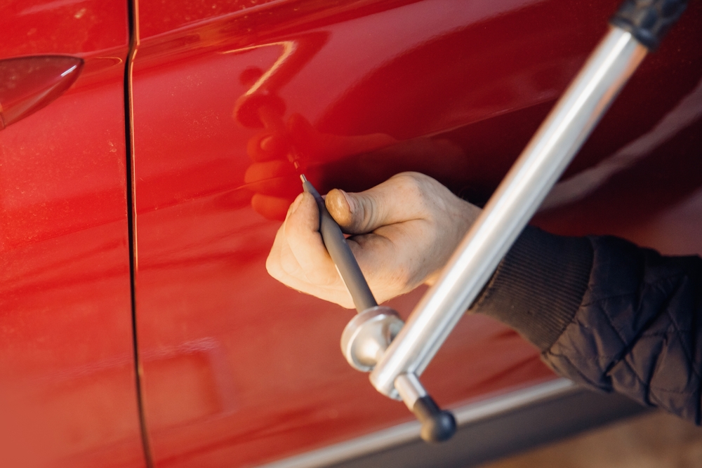 Paintless dent repair technician