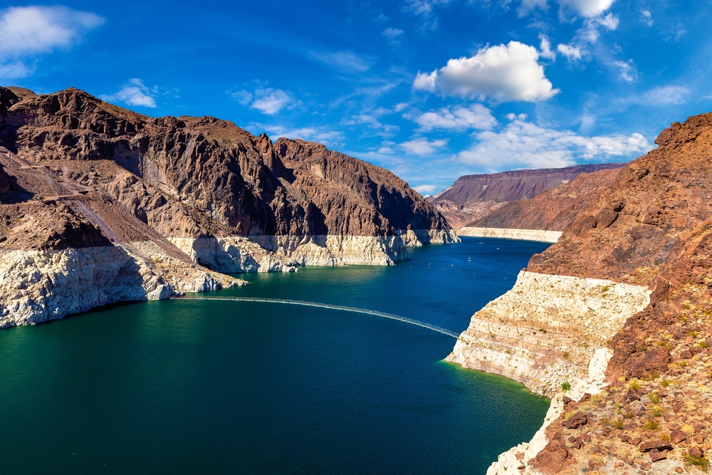 Colorado River water below pale exposed rock bands near Hoover Dam at Lake Mead