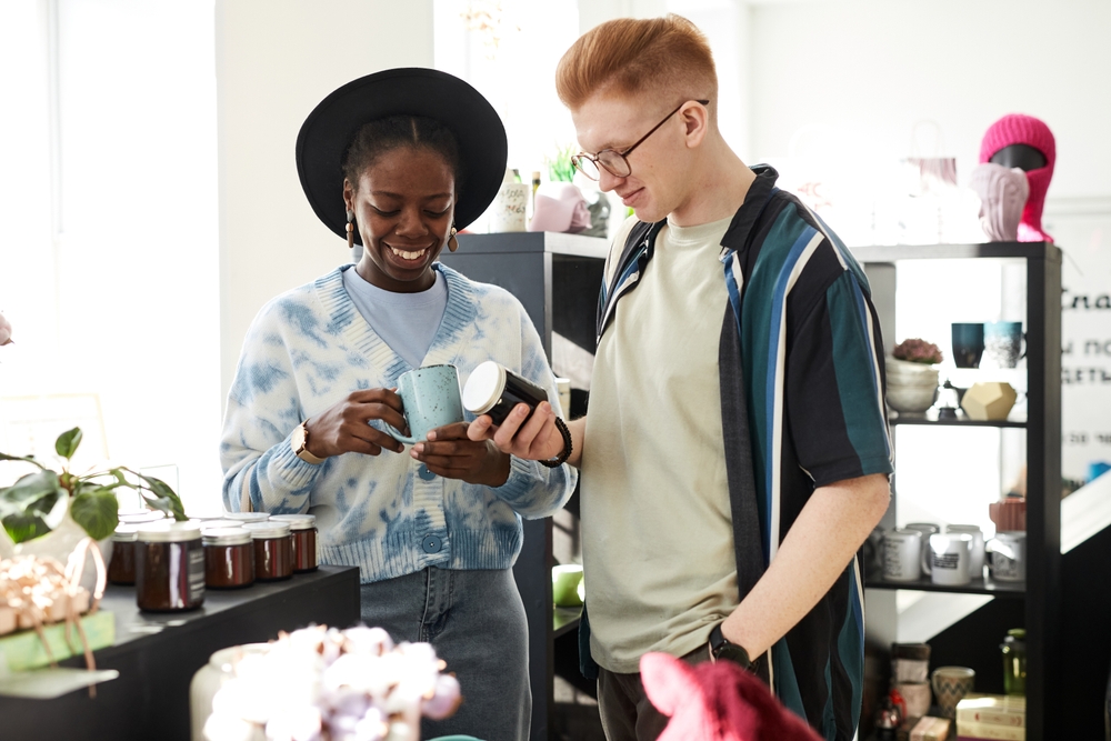 couple looking at homeware in thrift store