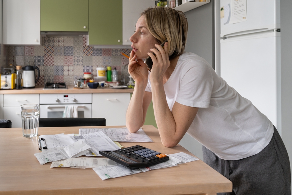 woman worried about household bills