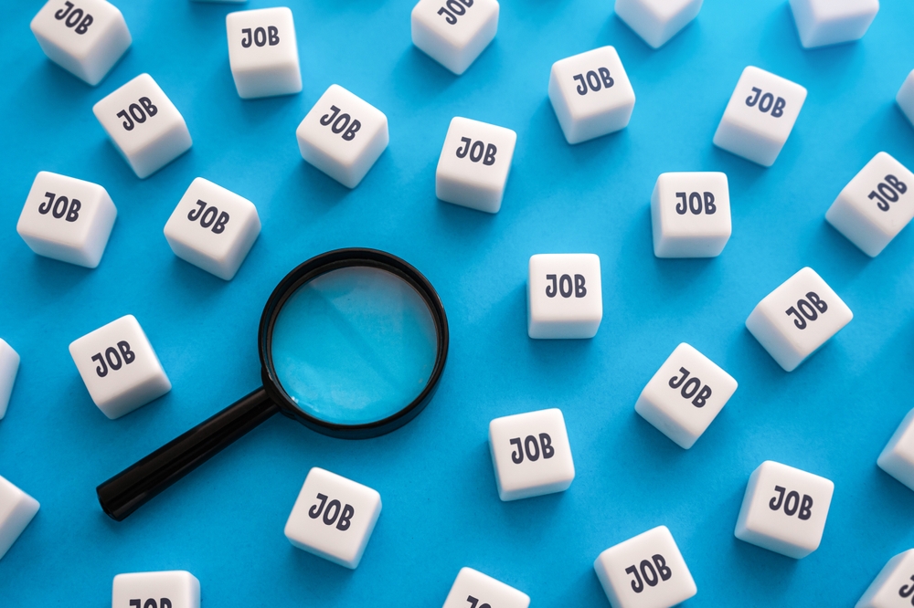 word job written on dice and magnifying glass