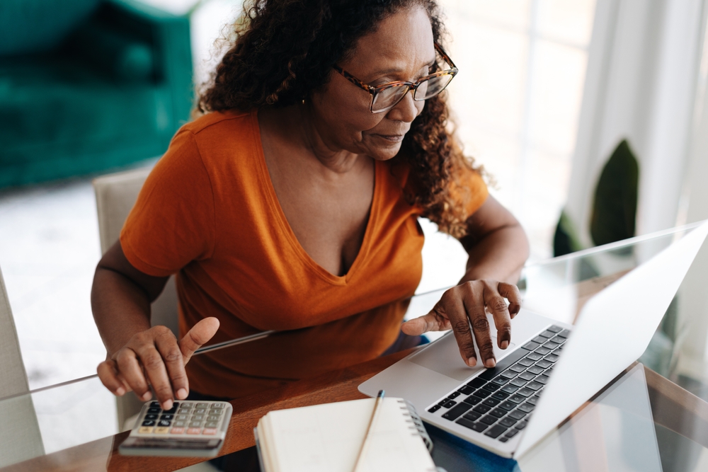 retiree working out budget with calculator