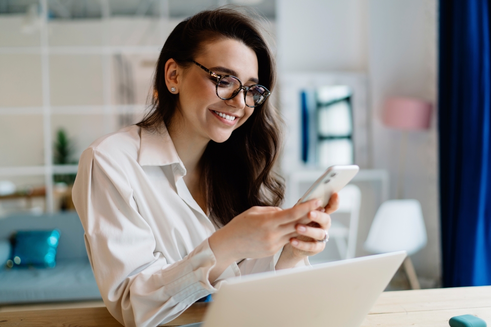 woman happy with phone provider