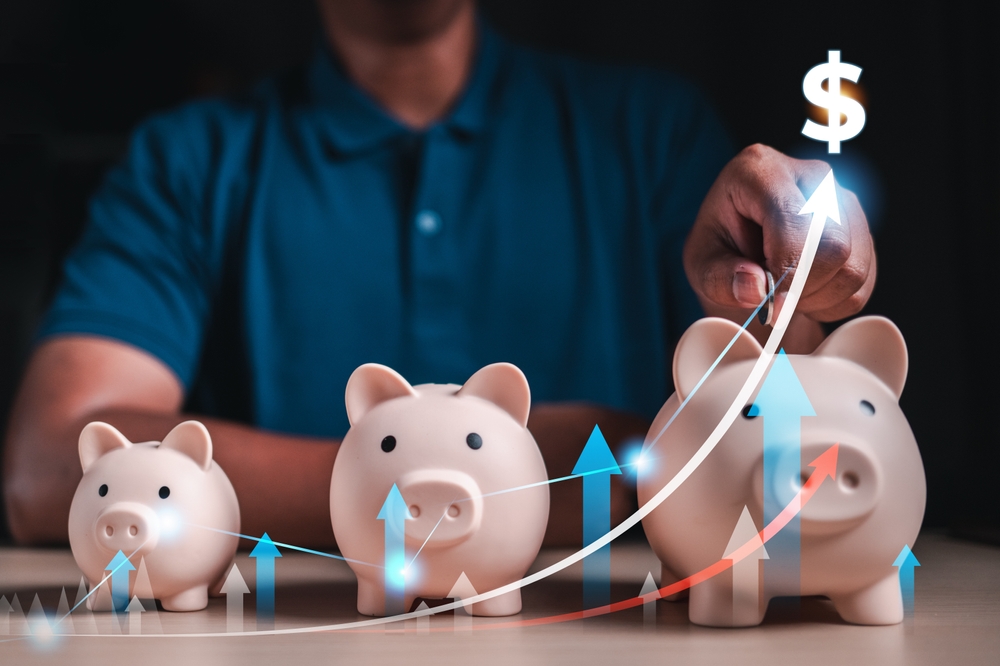 piggy banks getting larger as saving money