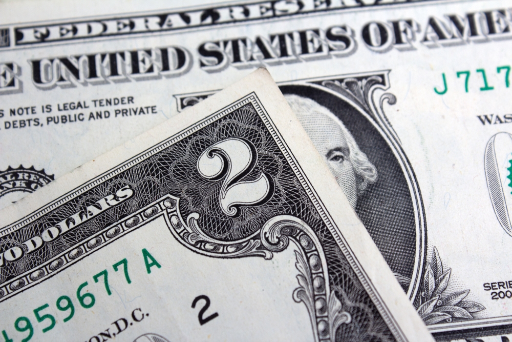 Close-up of the engraved printing and serial numbers on US dollar banknotes