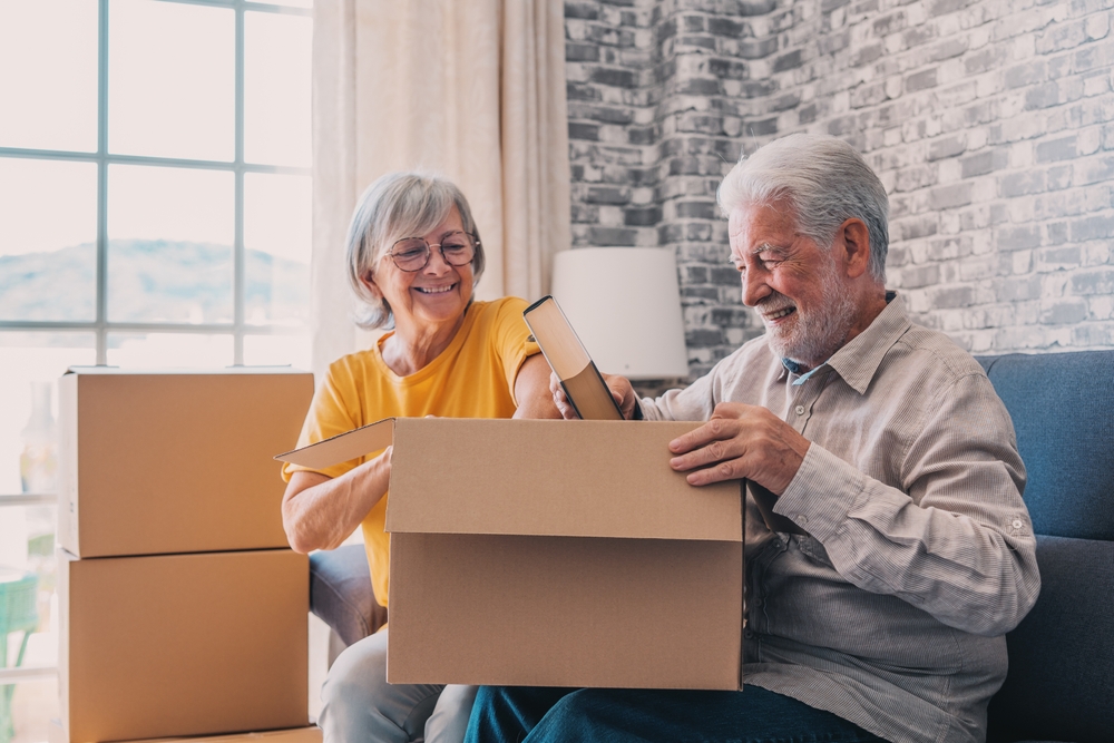 mature couple packing to move house