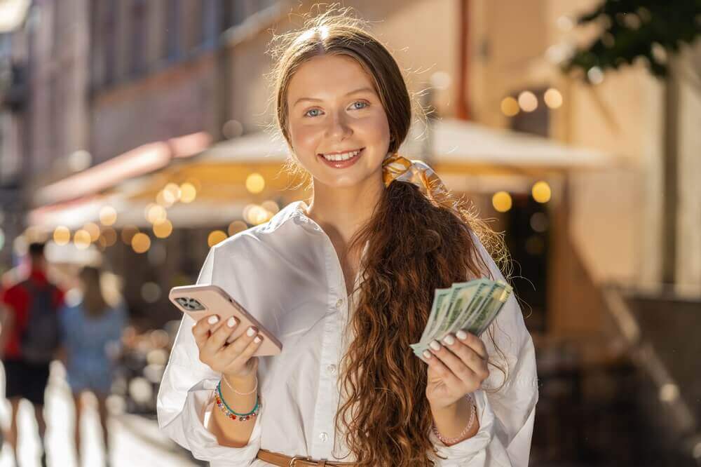 woman with cash in her hand