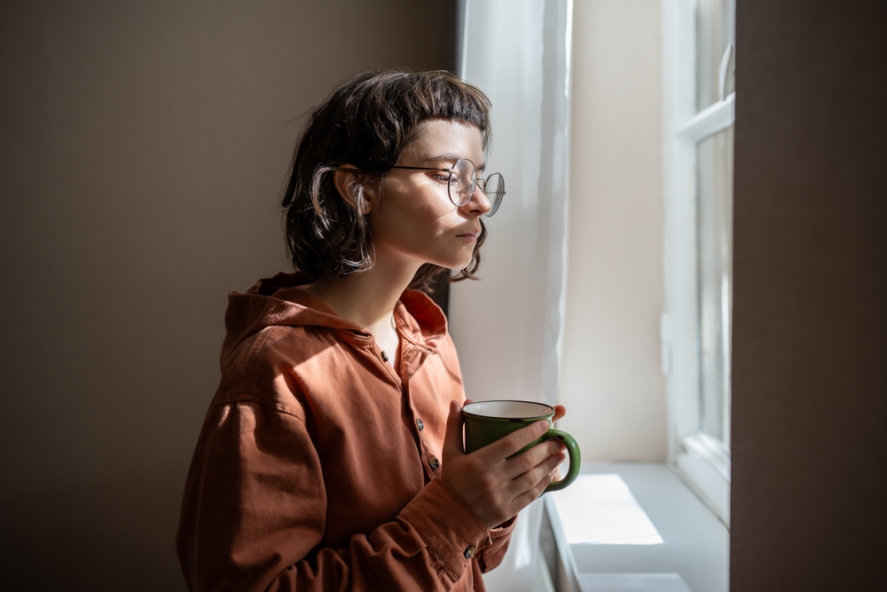 Introvert looking out of window