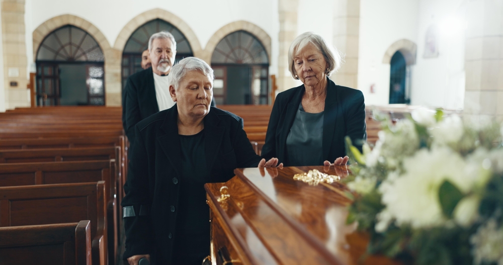 senior woman at coffin