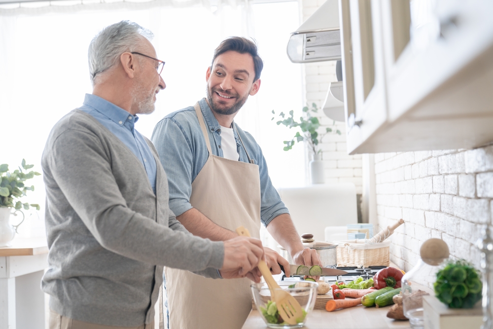 older parent and older child cooking