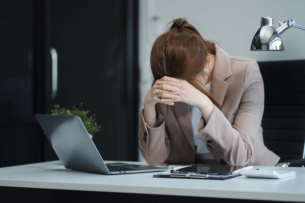 confused and stressed person at computer