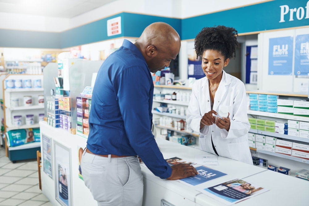 pharmacist handing over prescription